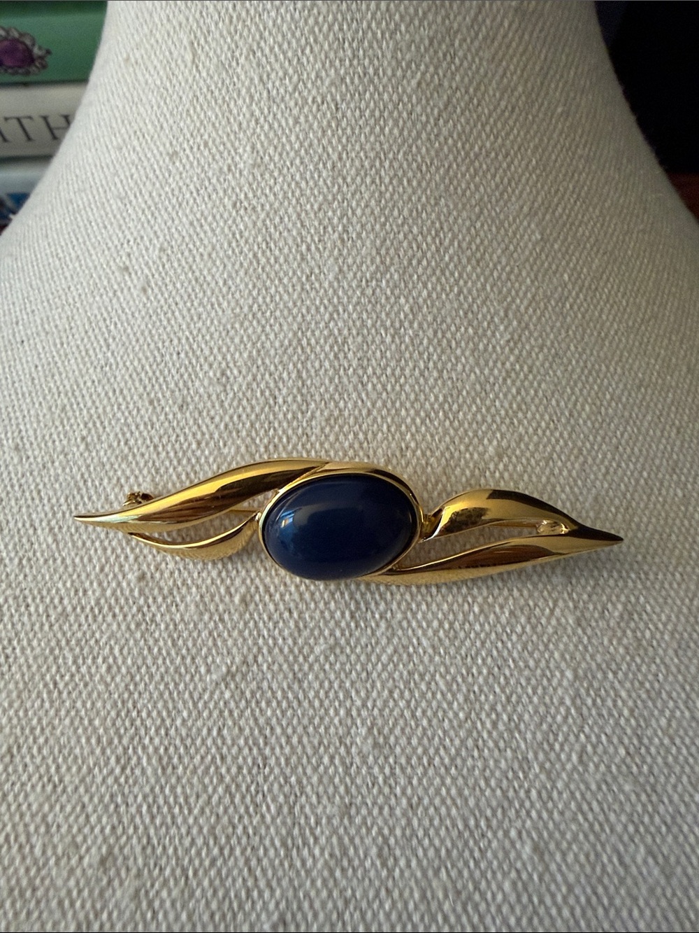 Monet Vintage Signed Gold Tone Brooch with Dark Blue Cabochon Center. Circa 80’s